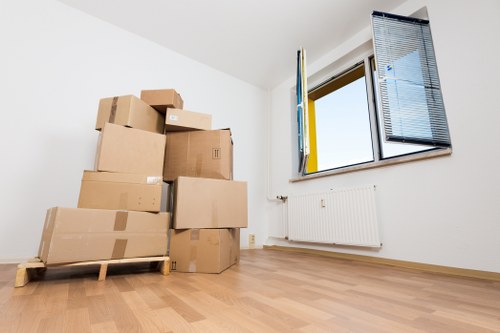 Professional movers loading furniture during a Tooting home move